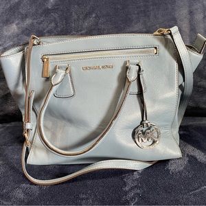 Light blue Michael Kors bag with dust bag.